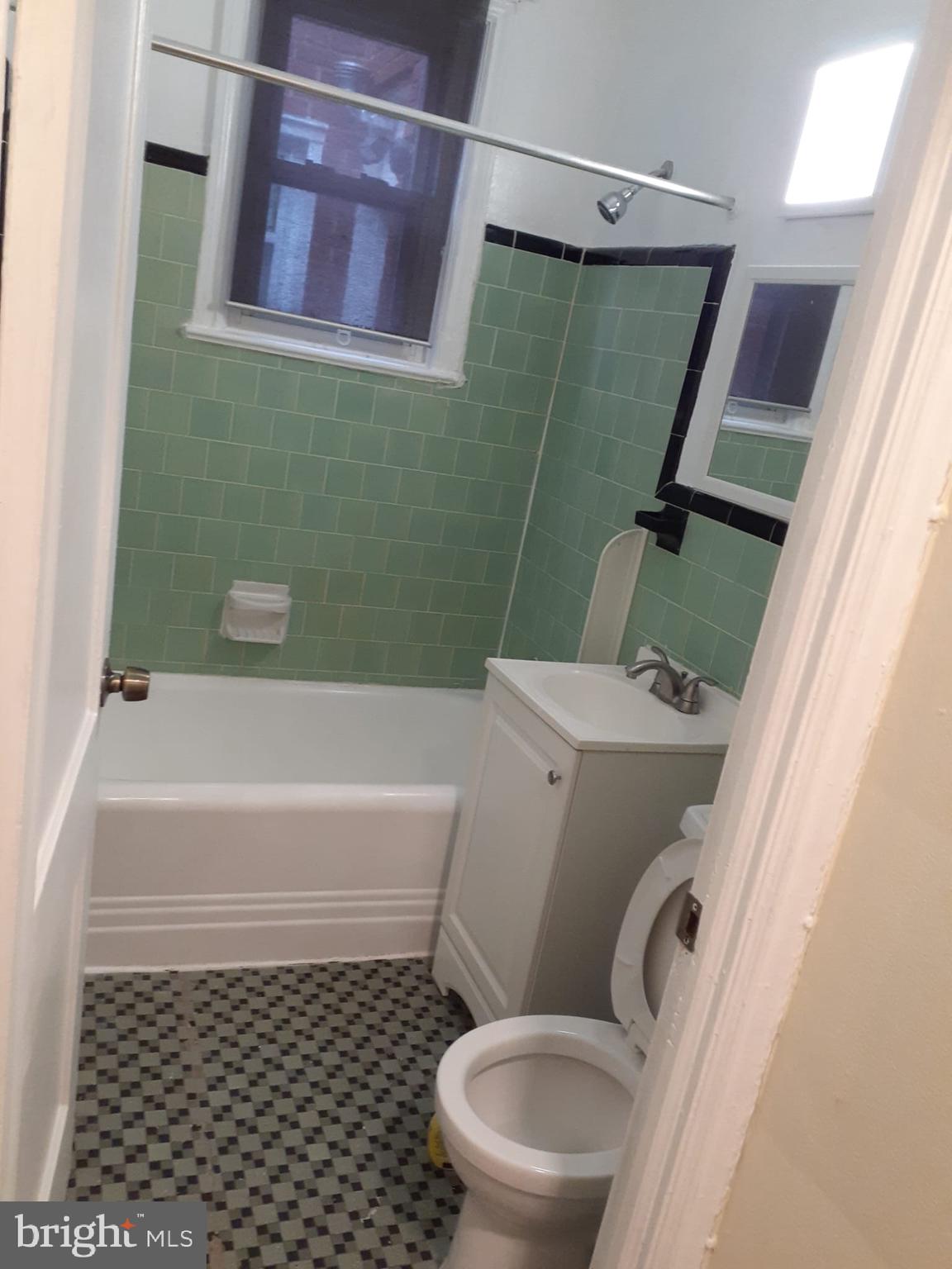 4820 New Hampshire Avenue Northwest Washington, DC 20011 - Photo 6 of 11 a bathroom with a toilet and a bathtub