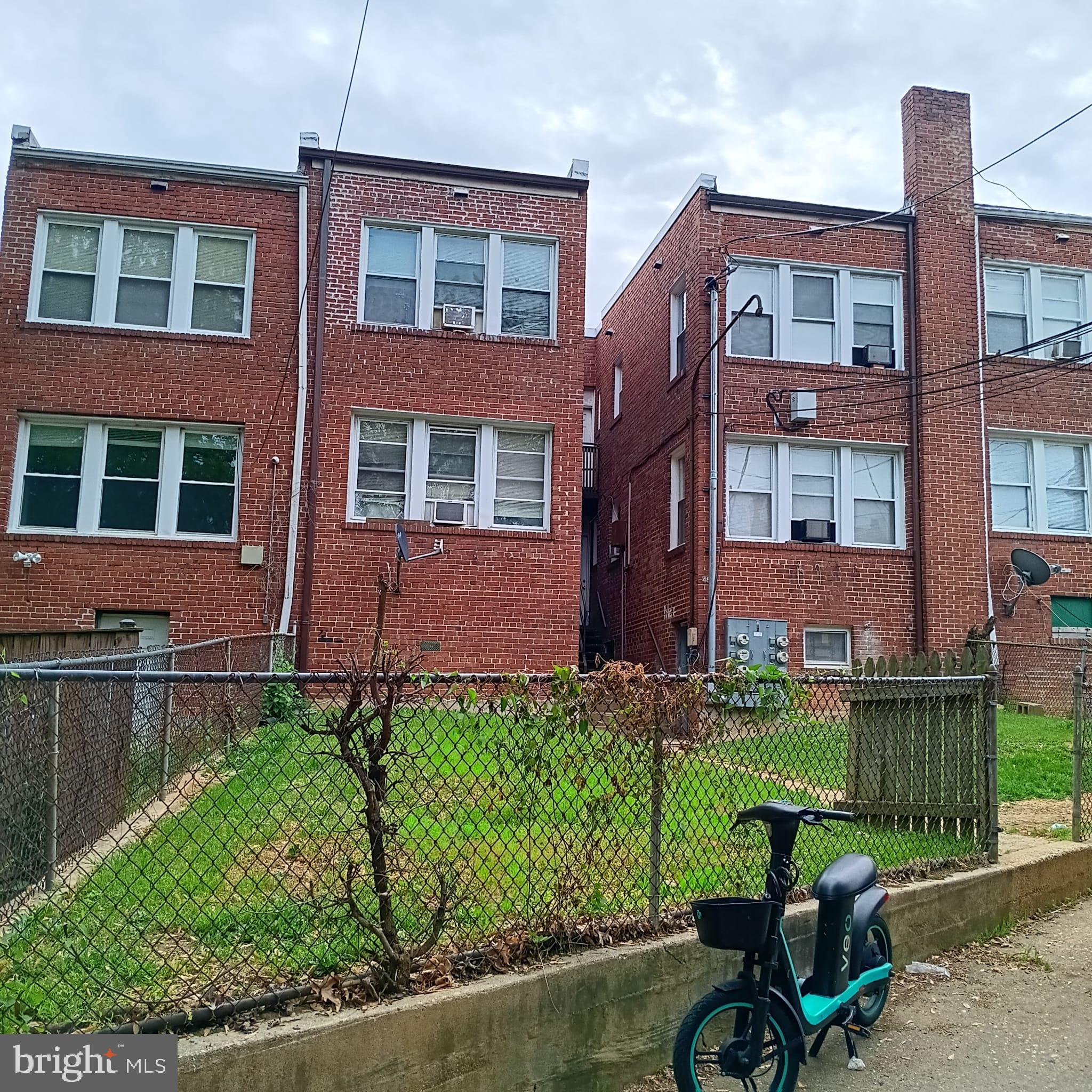 4820 New Hampshire Avenue Northwest Washington, DC 20011 - Photo 9 of 11 a view of a brick building next to a yard