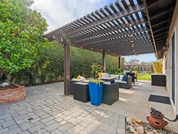a view of a patio and garden