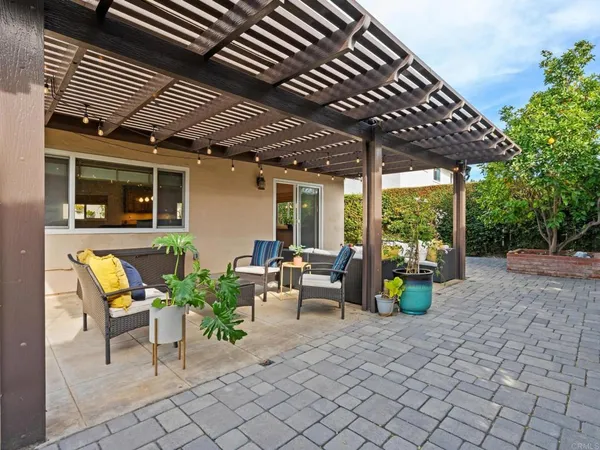 a view of a porch with chairs and furniture