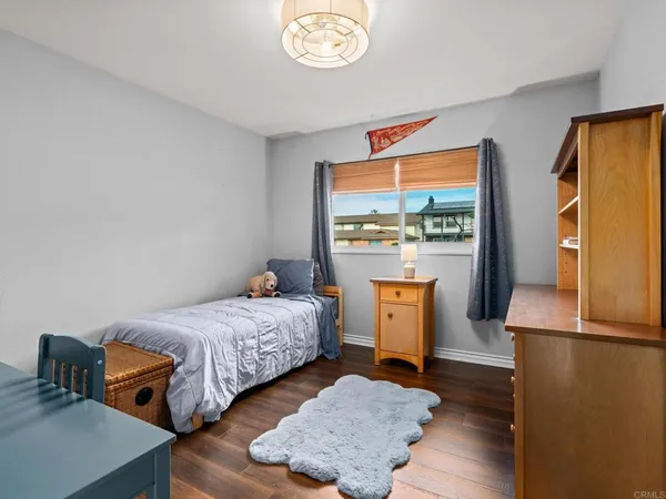 a bedroom with bed and a window