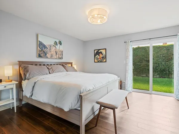 a bedroom with a bed and a table