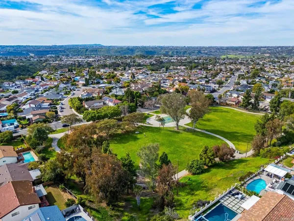 an aerial view of residential houses with outdoor space