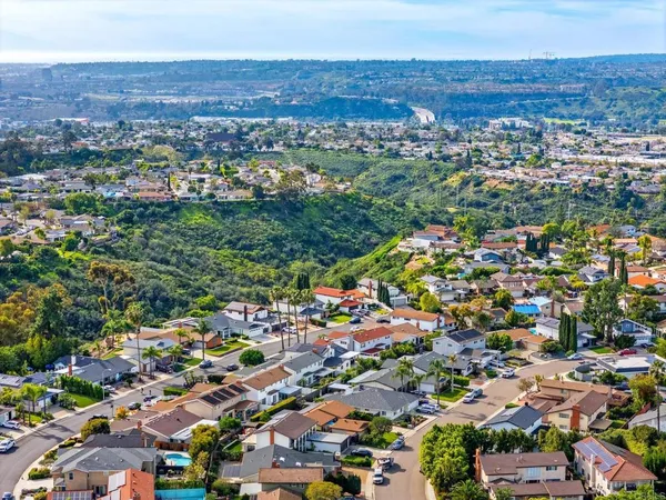 an aerial view of a city with lots of residential buildings