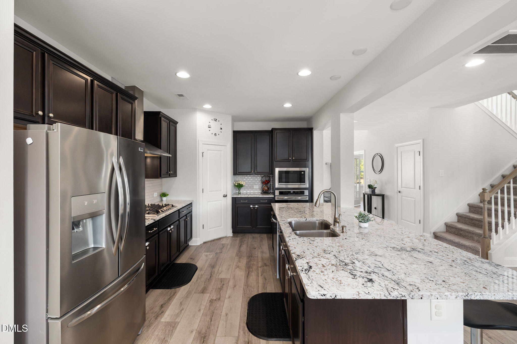 3422 Longleaf Estates Drive Raleigh, NC 27616 - Photo 16 of 71 a kitchen with stainless steel appliances granite countertop a refrigerator and a sink