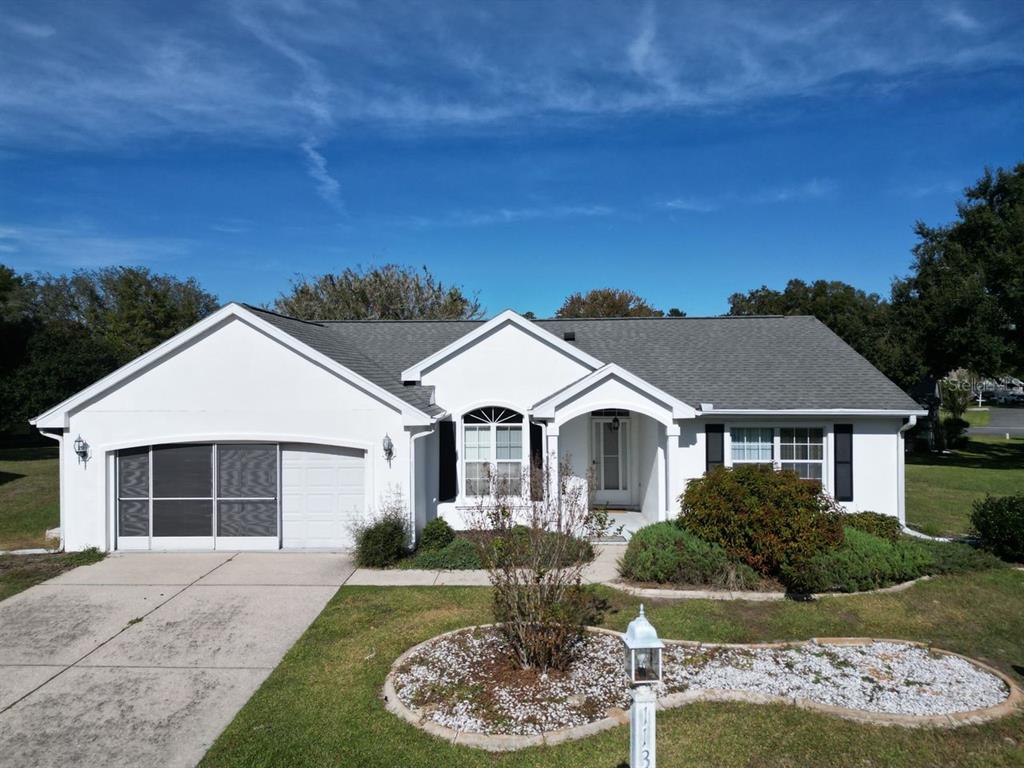 11340 Southwest 76th Circle Ocala, FL 34476 - Photo 1 of 42 front view of a house with a yard