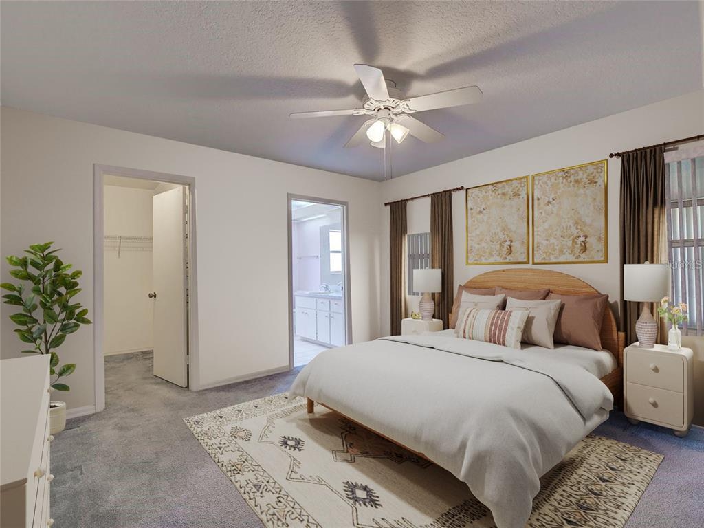 11340 Southwest 76th Circle Ocala, FL 34476 - Photo 14 of 42 a bedroom with a large bed and a chandelier