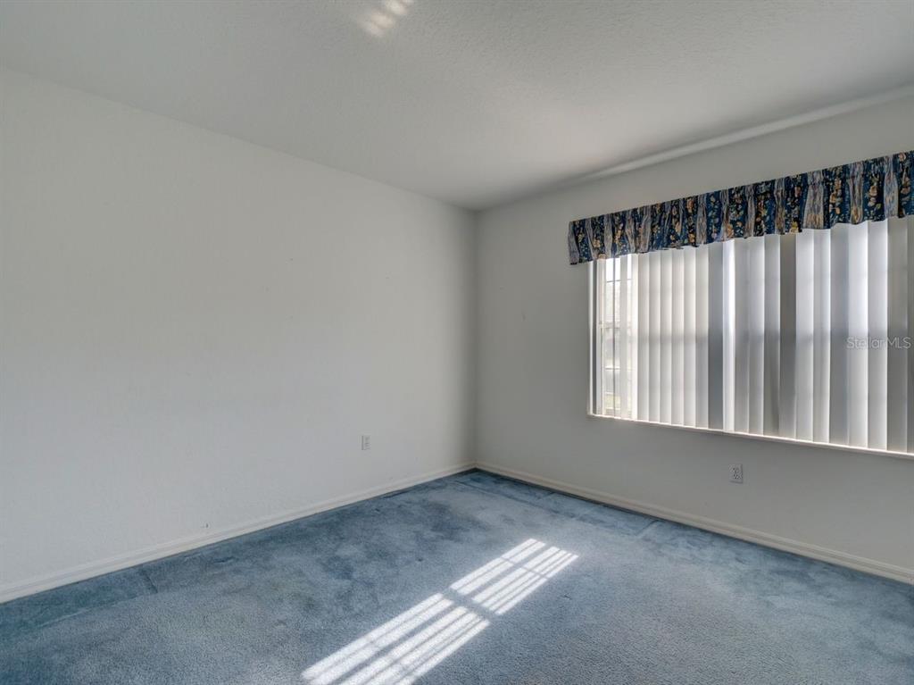 11340 Southwest 76th Circle Ocala, FL 34476 - Photo 18 of 42 an empty room with a window