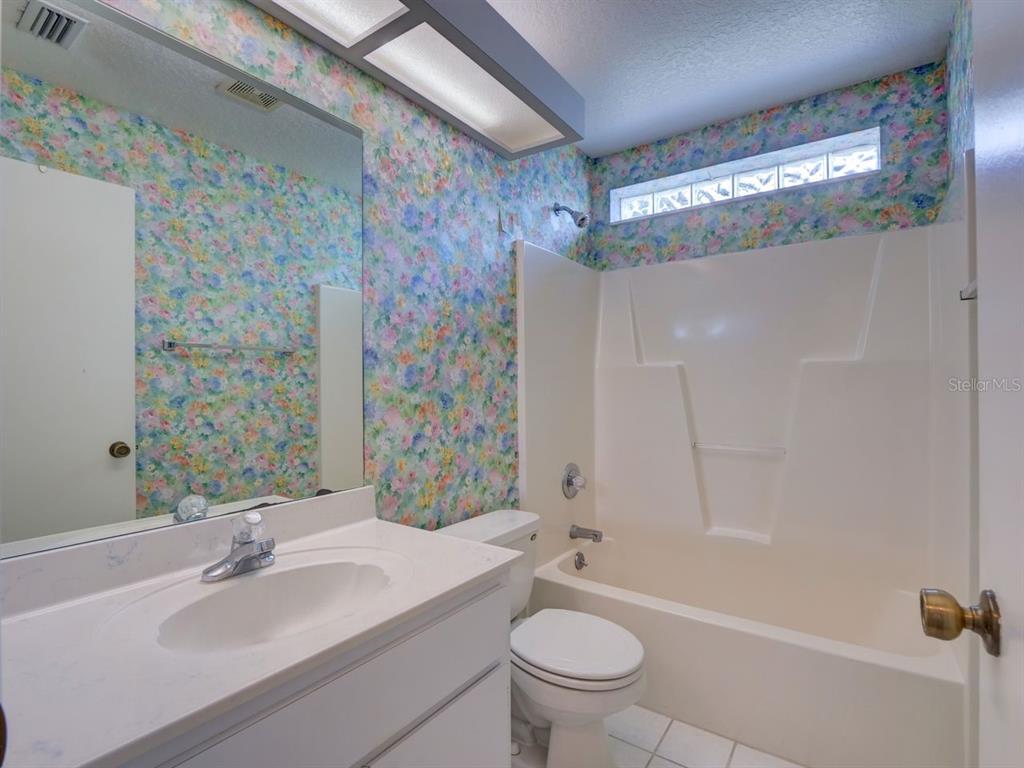 11340 Southwest 76th Circle Ocala, FL 34476 - Photo 19 of 42 a bathroom with a sink toilet and shower