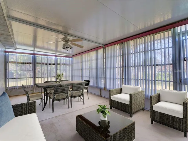 a view of a big room with windows