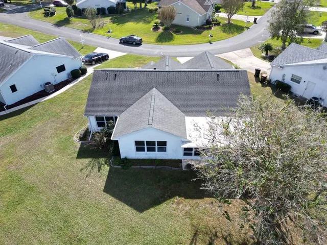 a aerial view of a house with a yard