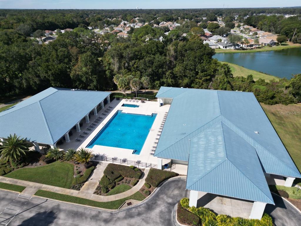 11340 Southwest 76th Circle Ocala, FL 34476 - Photo 37 of 42 an aerial view of a house with a garden and lake view