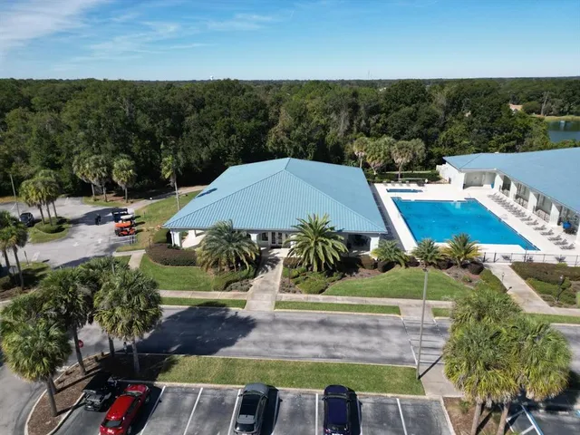 a view of swimming pool with a yard