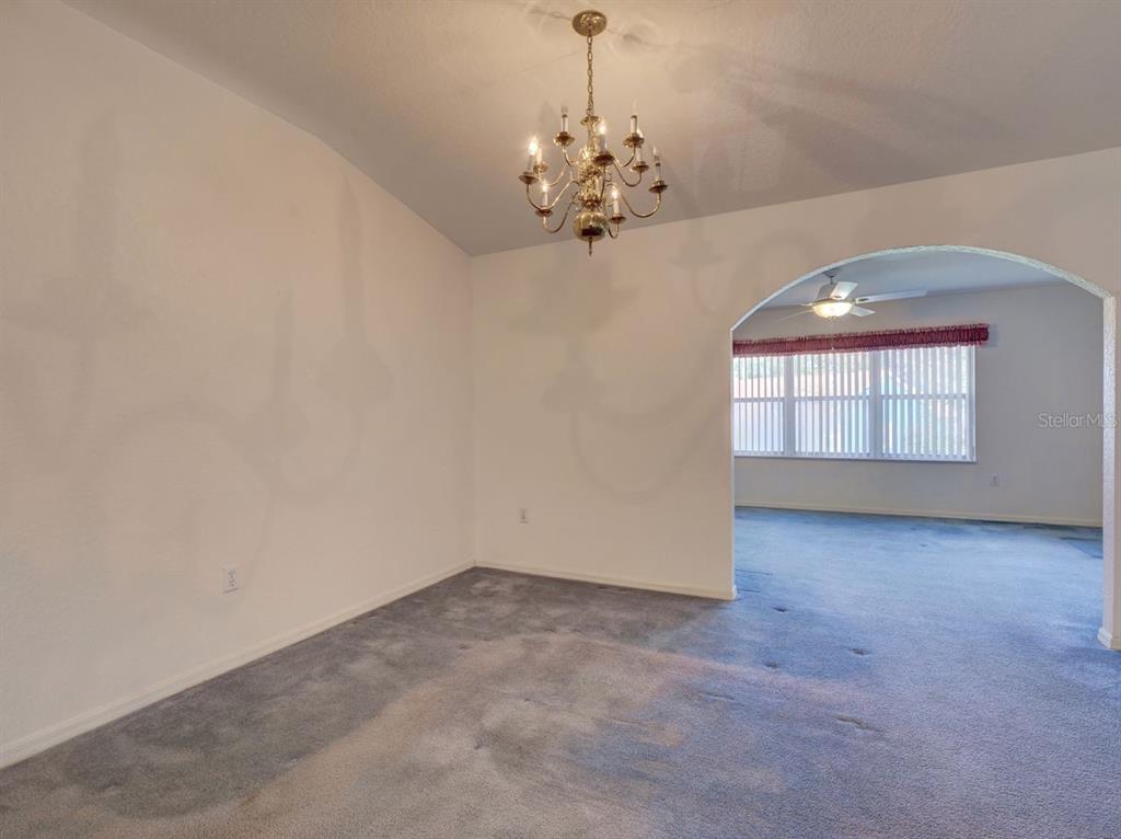 11340 Southwest 76th Circle Ocala, FL 34476 - Photo 8 of 42 wooden floor in an empty room with a window