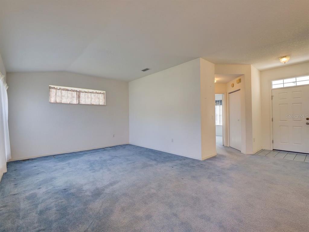 11340 Southwest 76th Circle Ocala, FL 34476 - Photo 10 of 42 an empty room with windows