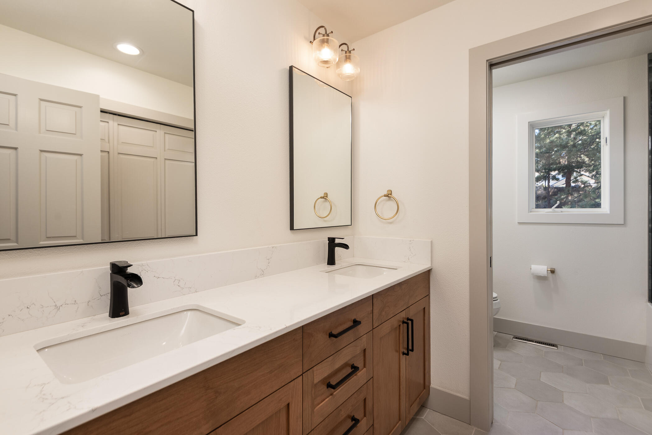 60012 West Ridgeview Drive Bend, OR 97702 - Photo 20 of 55 a bathroom with a sink and a mirror