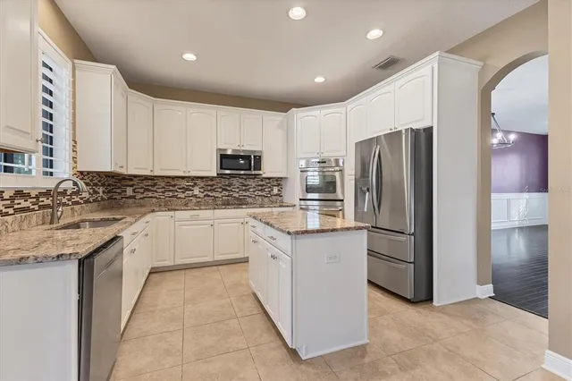 a view of livingroom with hardwood floor and a ceiling fan