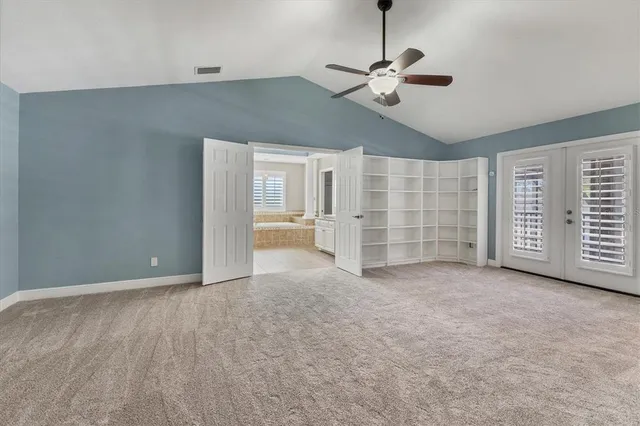 a spacious bathroom with a granite countertop tub sink and mirror