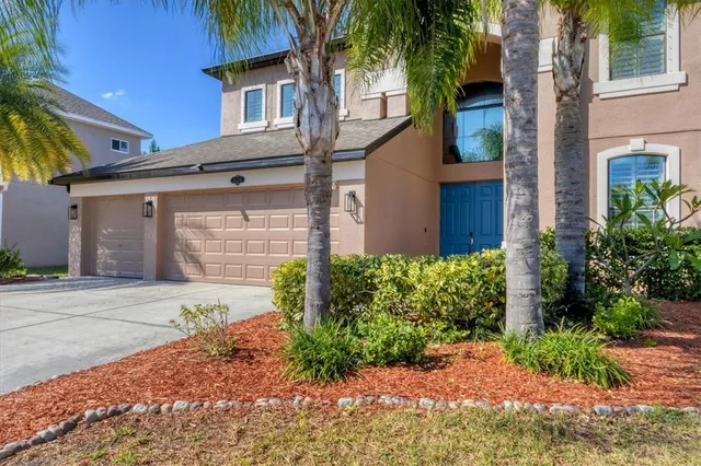 a living room with furniture a flat screen tv and a large window