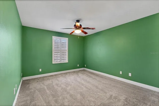a kitchen with a stove a sink and a wooden cabinets