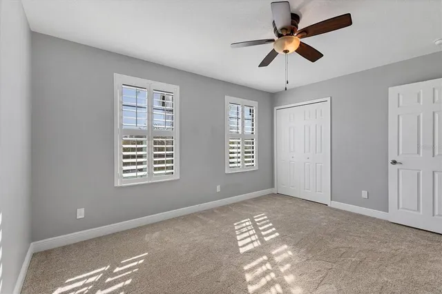 a view of a swimming pool with outdoor seating
