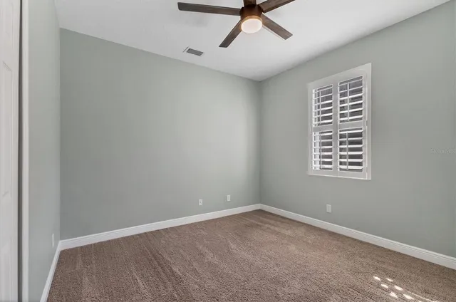 an aerial view of residential houses with city view