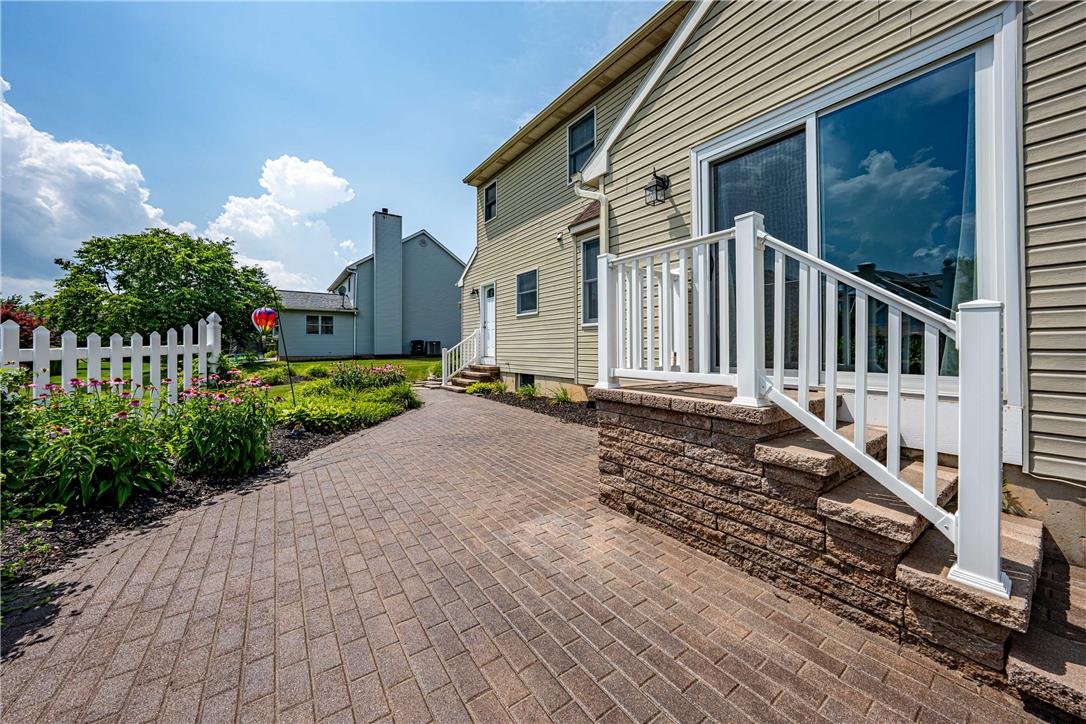 4568 Greenfield Road Bethlehem, PA 18017 - Photo 43 of 59 A charming backyard retreat featuring a brick paver patio and flourishing garden beds.