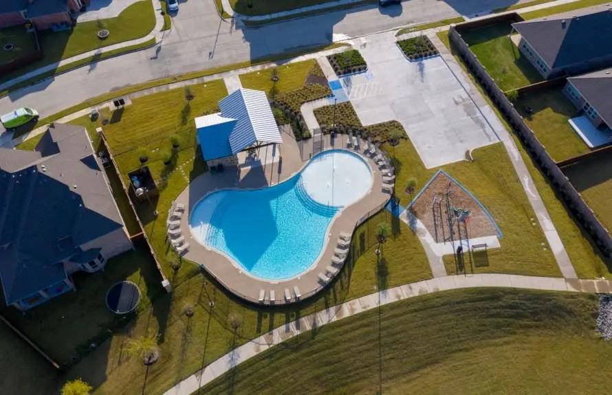 636 Corner Post Path Celina, TX 75009 - Photo 40 of 40 Resort-style pool area featuring a freeform swimming pool, integrated shallow lounging area, and a covered pavilion