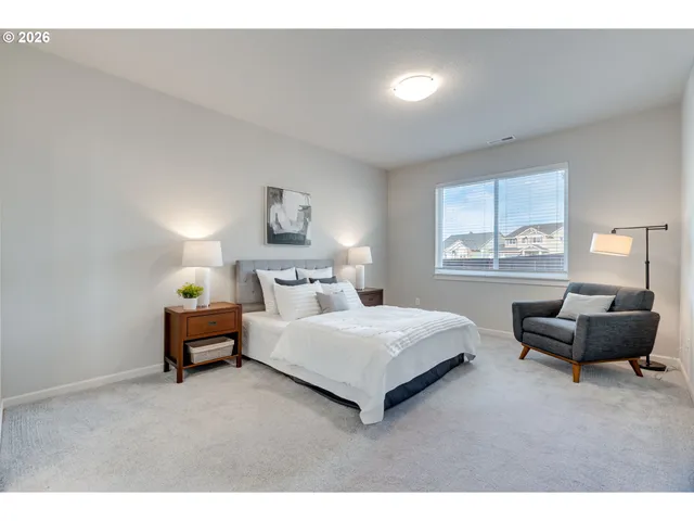 a bedroom with a bed and a couch