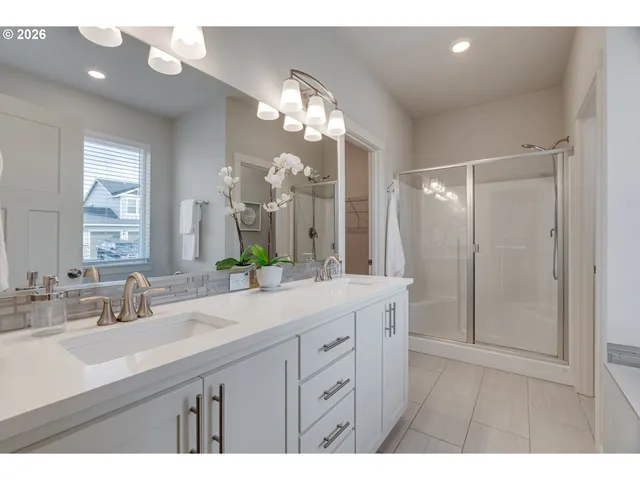 a bathroom with a sink vanity and a mirror