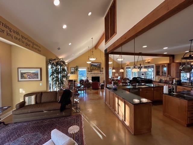 306 Charles Road Kerrville, TX 78028 - Photo 13 of 50 a kitchen with stainless steel appliances granite countertop a stove and cabinets