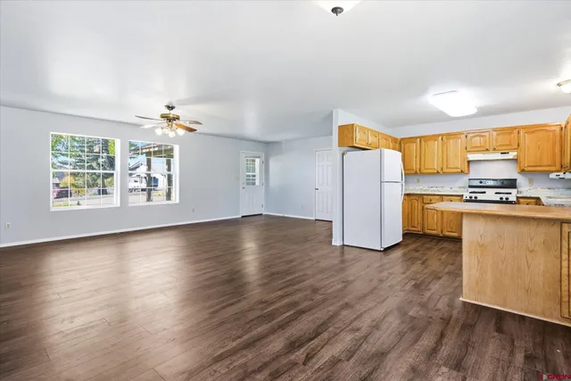 a view of kitchen with furniture and wooden floor