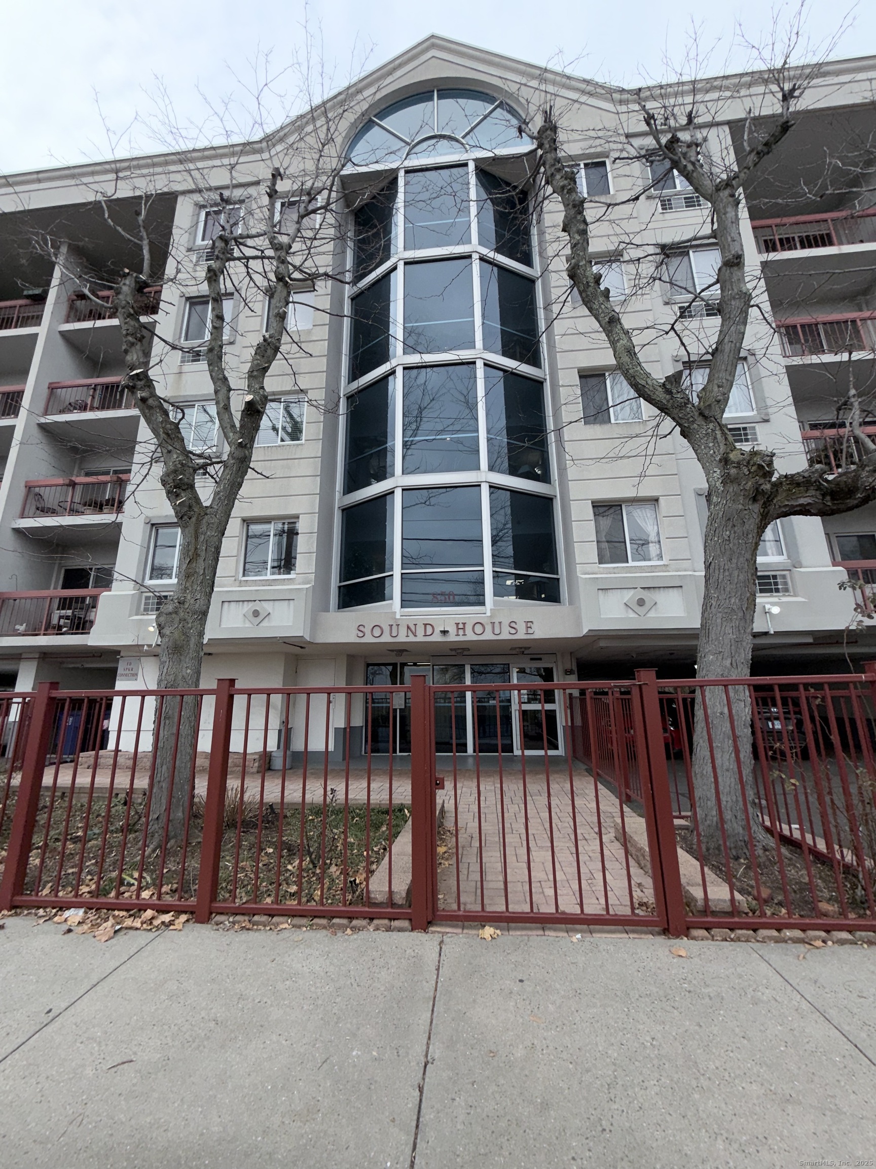 850 Atlantic Street, Unit 208 Bridgeport, CT 06604 - Photo 16 of 16 a view of a large building with large windows