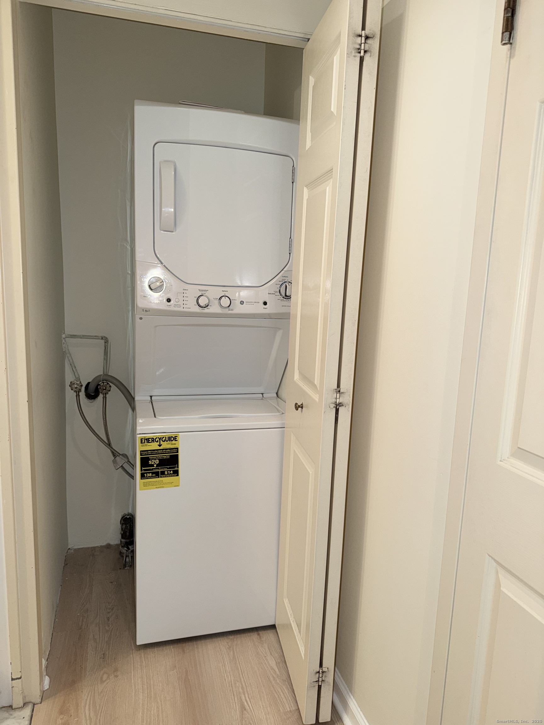 850 Atlantic Street, Unit 208 Bridgeport, CT 06604 - Photo 4 of 16 a utility room with dryer and washer