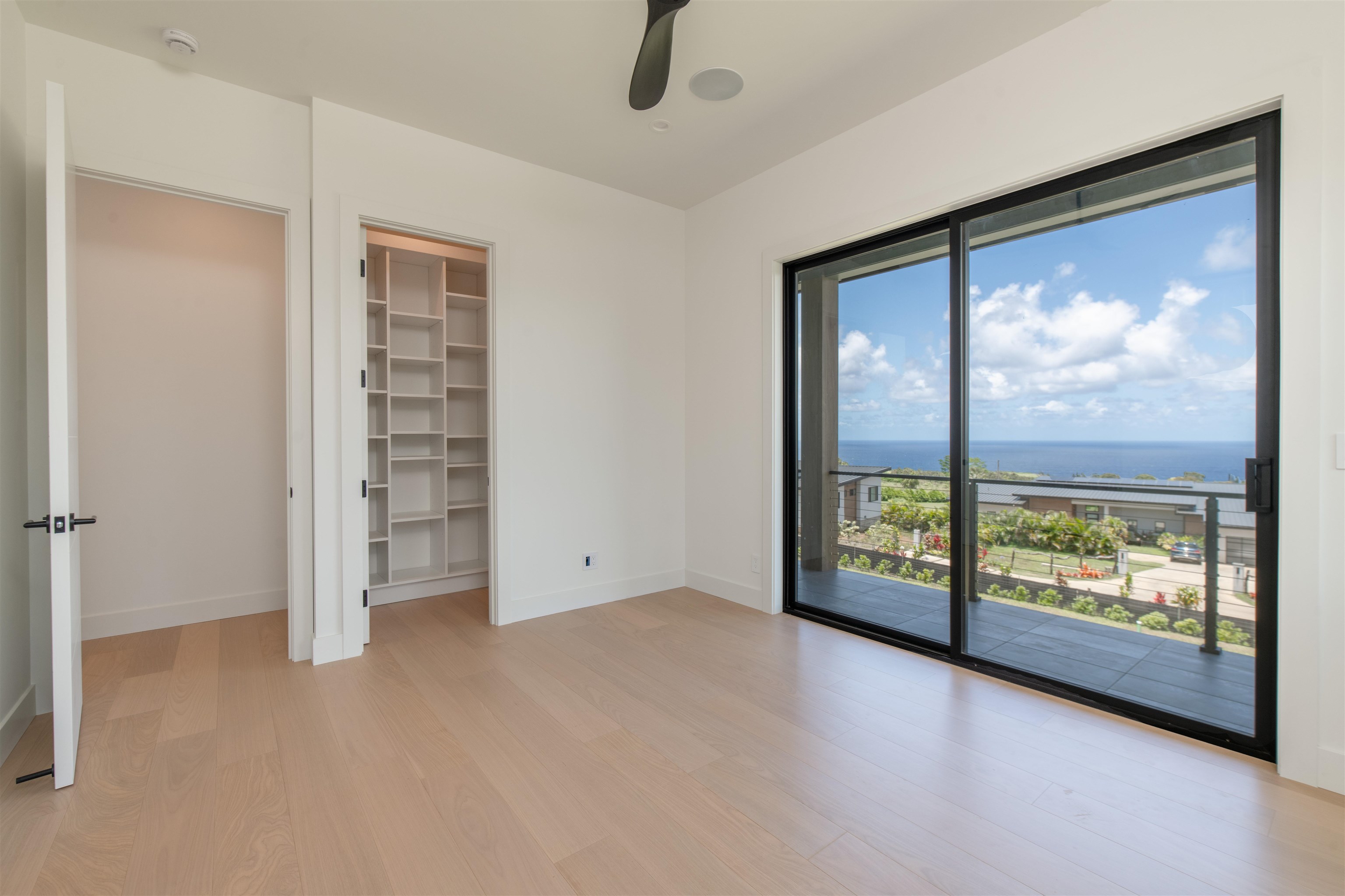 111 Mehana Road, Unit A Haiku, HI 96708 - Photo 37 of 50 an empty room with windows and view