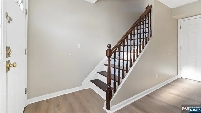an entryway with wooden floor