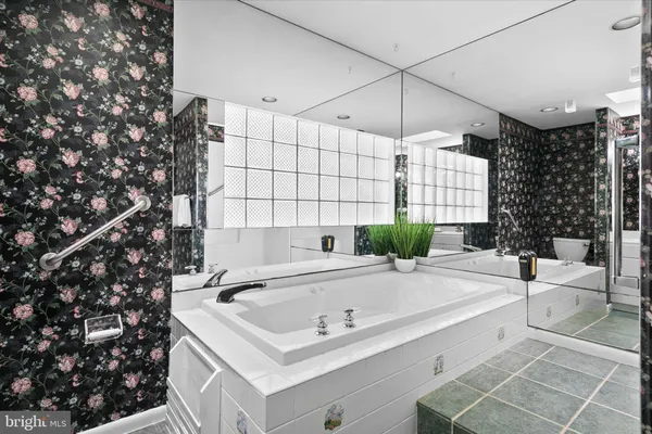 a bathroom with a bathtub and a sink
