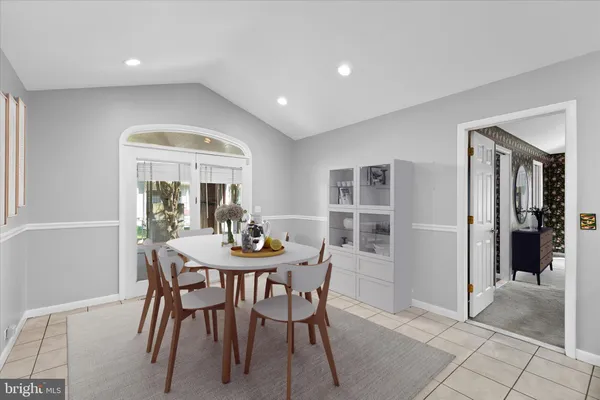 a view of a dining room with furniture and window