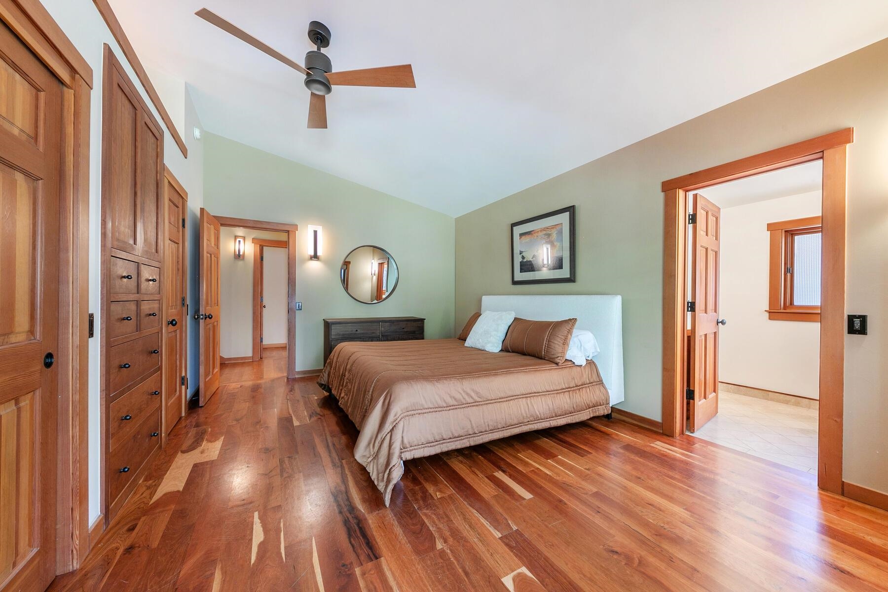 12167 Oslo Drive Truckee, CA 96161 - Photo 14 of 25 a bedroom with a bed and wooden floor