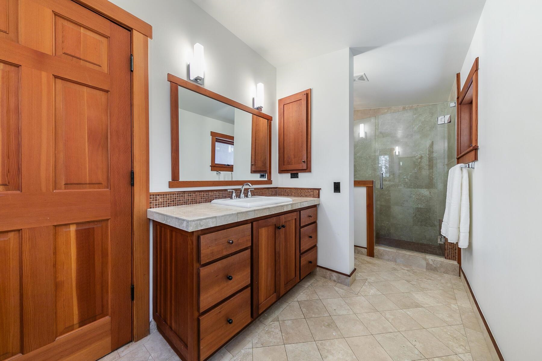 12167 Oslo Drive Truckee, CA 96161 - Photo 15 of 25 a bathroom with a sink and a mirror