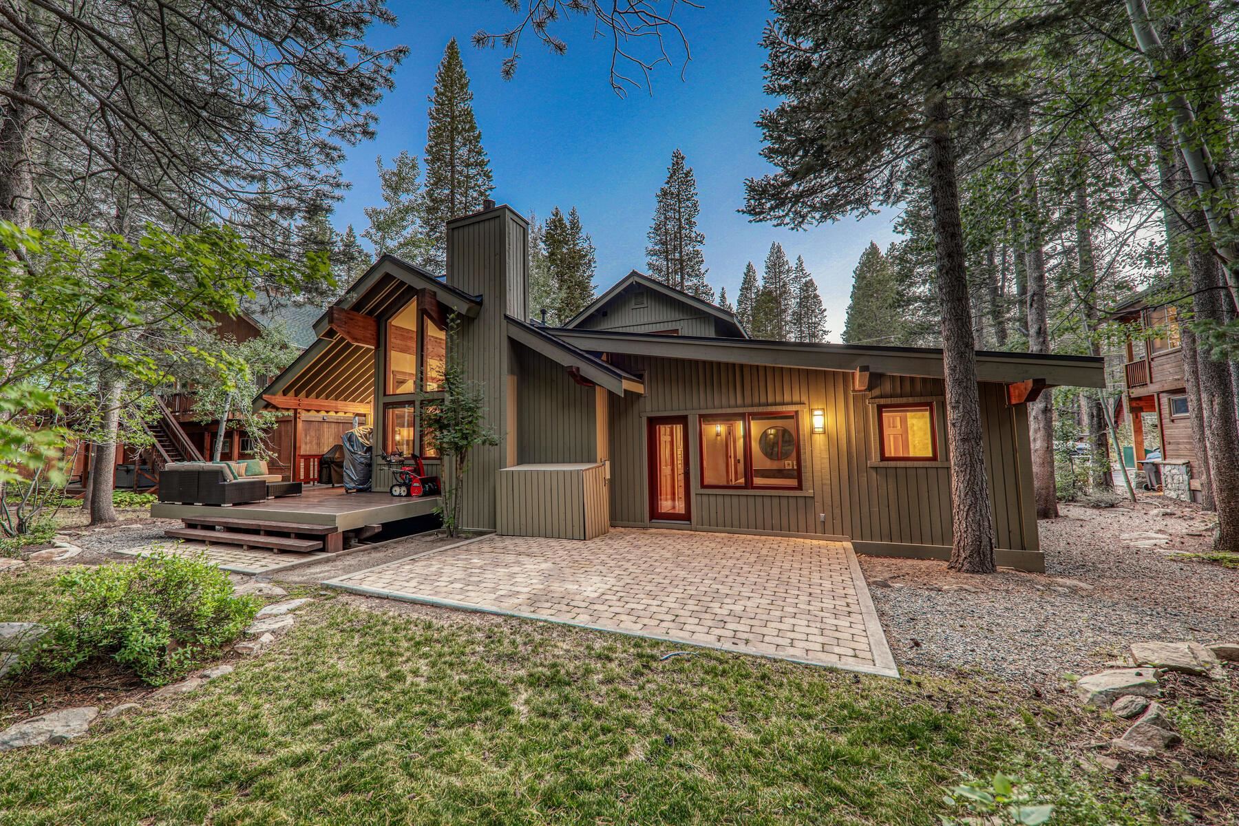 12167 Oslo Drive Truckee, CA 96161 - Photo 25 of 25 a front view of a house with a yard outdoor seating and garage