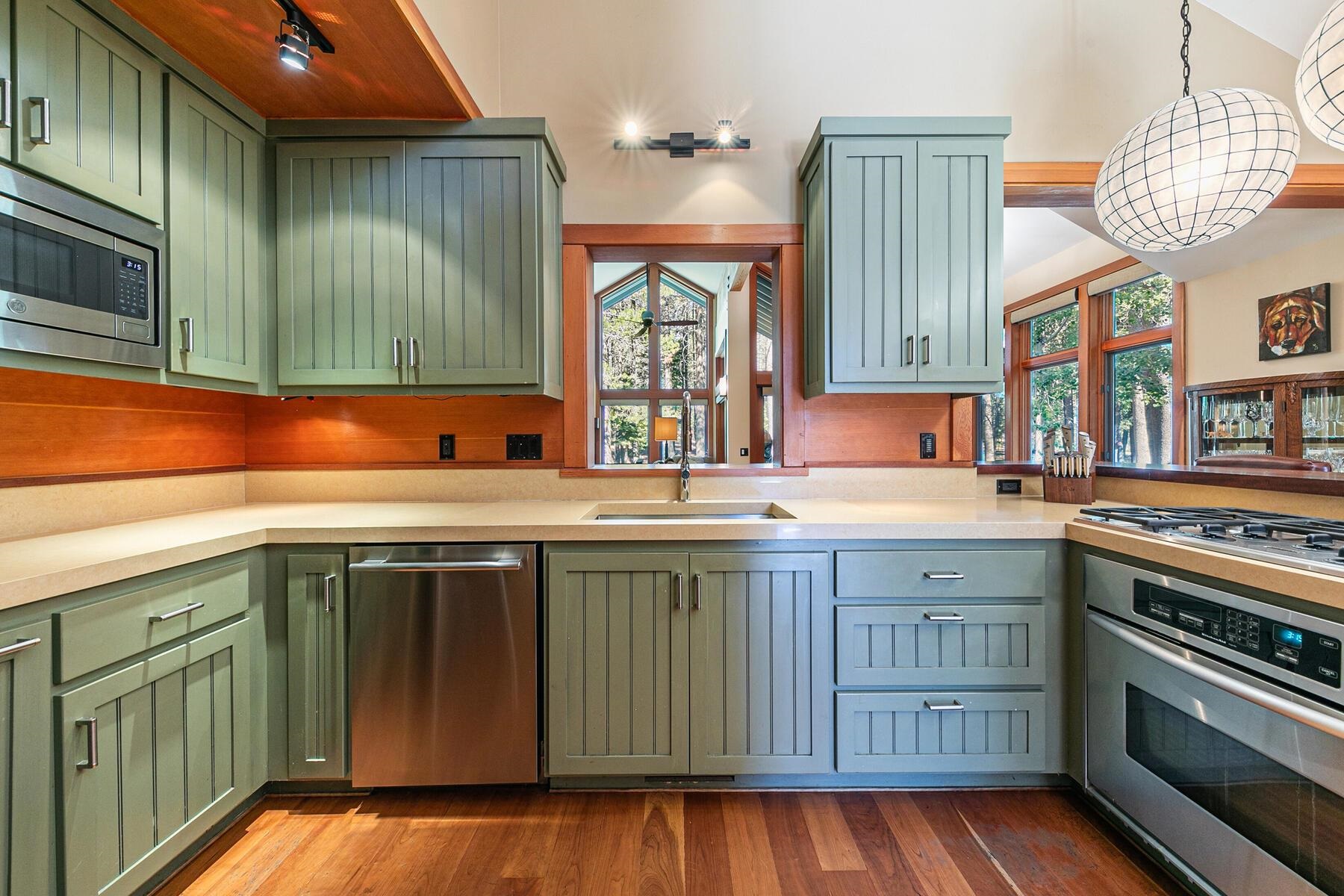 12167 Oslo Drive Truckee, CA 96161 - Photo 7 of 25 a kitchen with stainless steel appliances granite countertop a sink and a stove