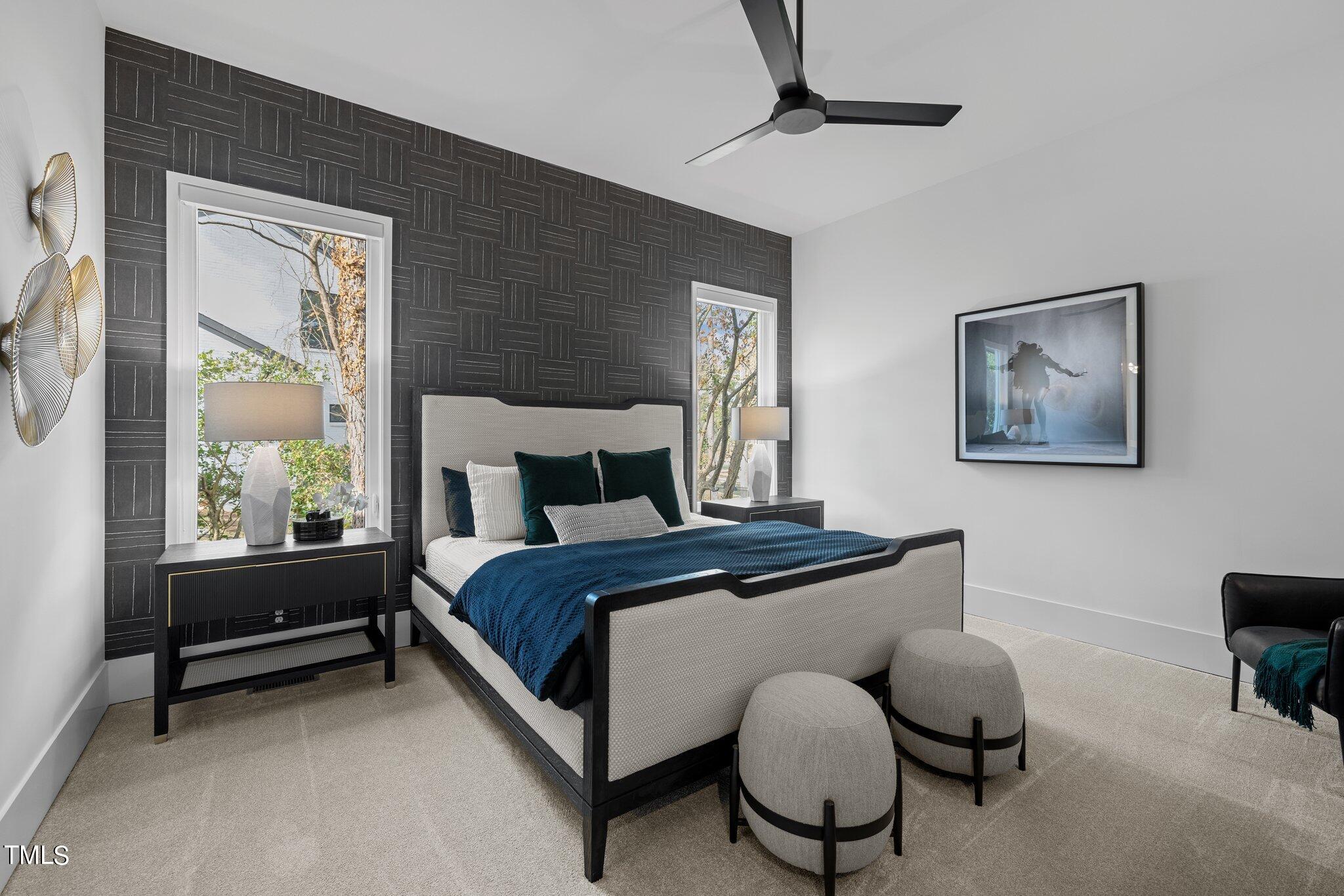 1711 Hunting Ridge Road Raleigh, NC 27615 - Photo 29 of 62 a bedroom with a bed and a chandelier