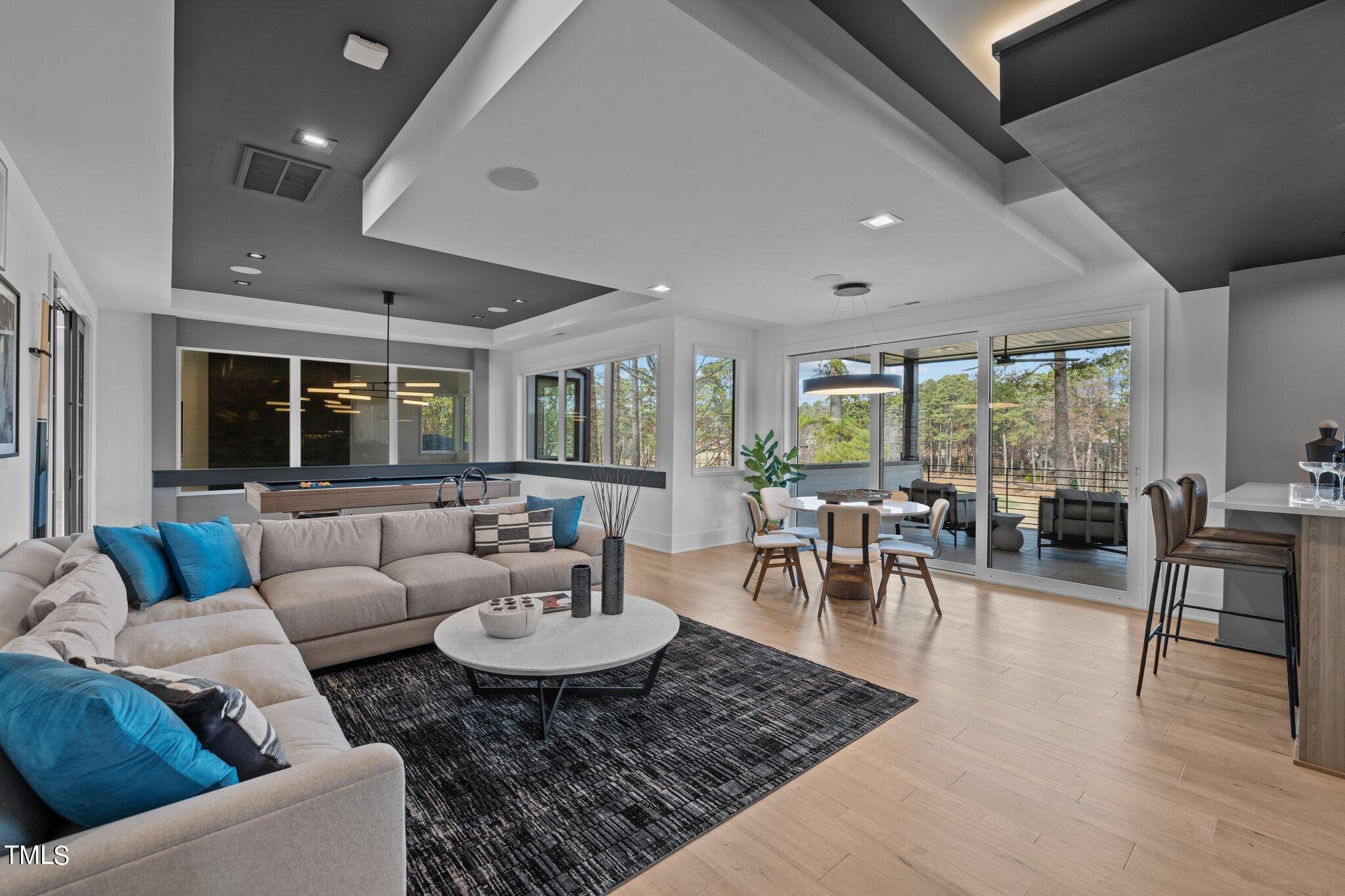 1711 Hunting Ridge Road Raleigh, NC 27615 - Photo 34 of 62 a living room with furniture and a large window