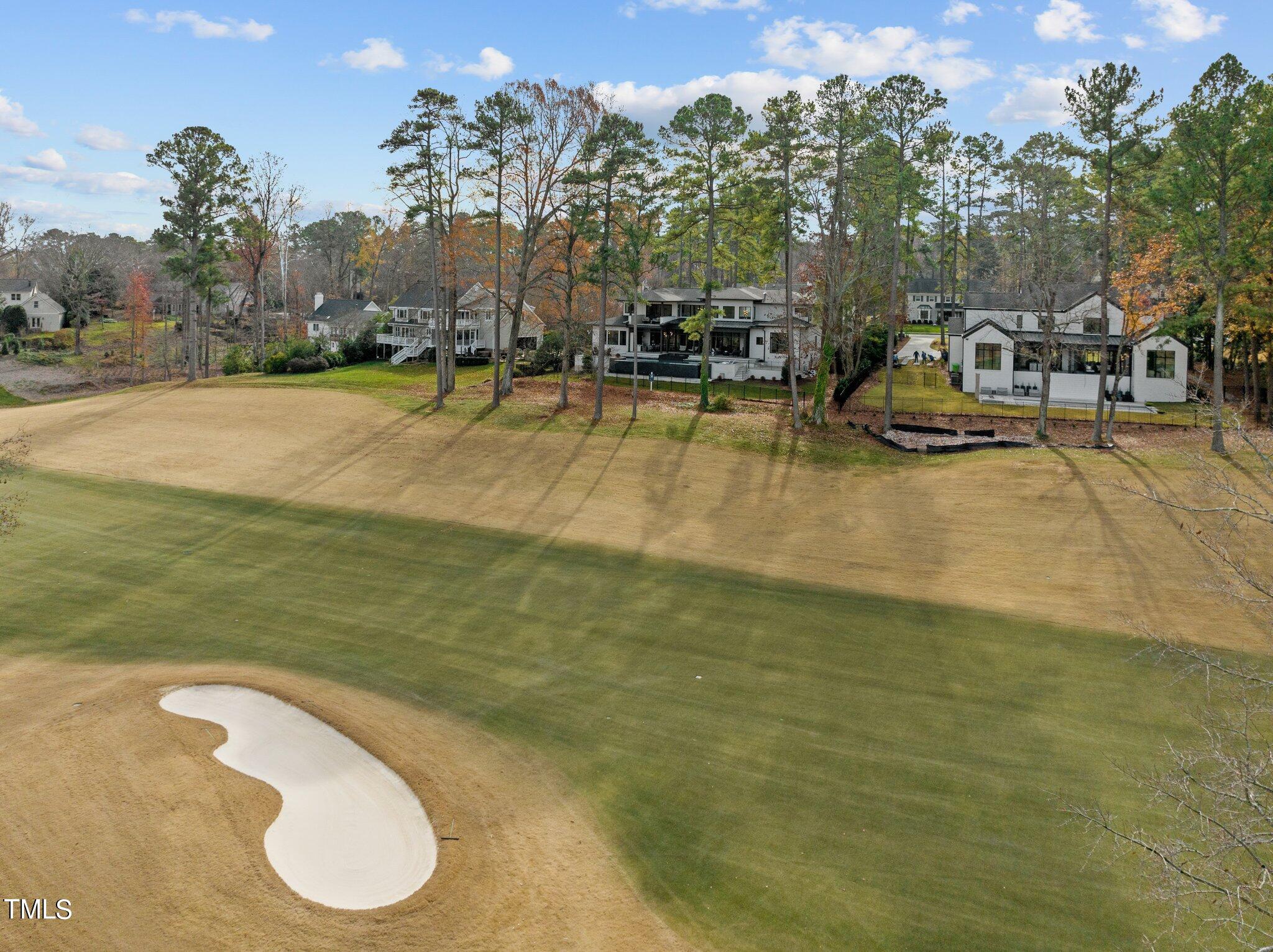 1711 Hunting Ridge Road Raleigh, NC 27615 - Photo 4 of 62 a swimming pool with outdoor seating and yard