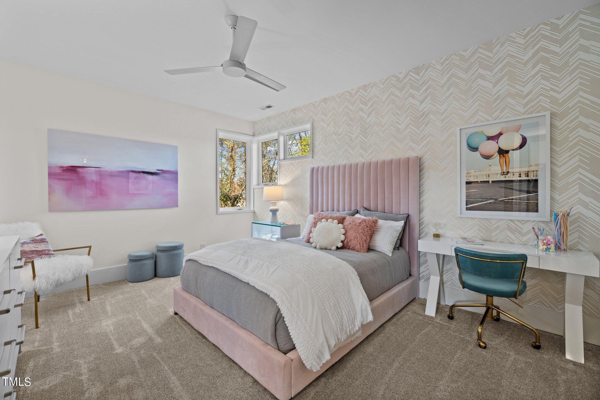 1711 Hunting Ridge Road Raleigh, NC 27615 - Photo 41 of 62 a spacious bedroom with a bed and a desk