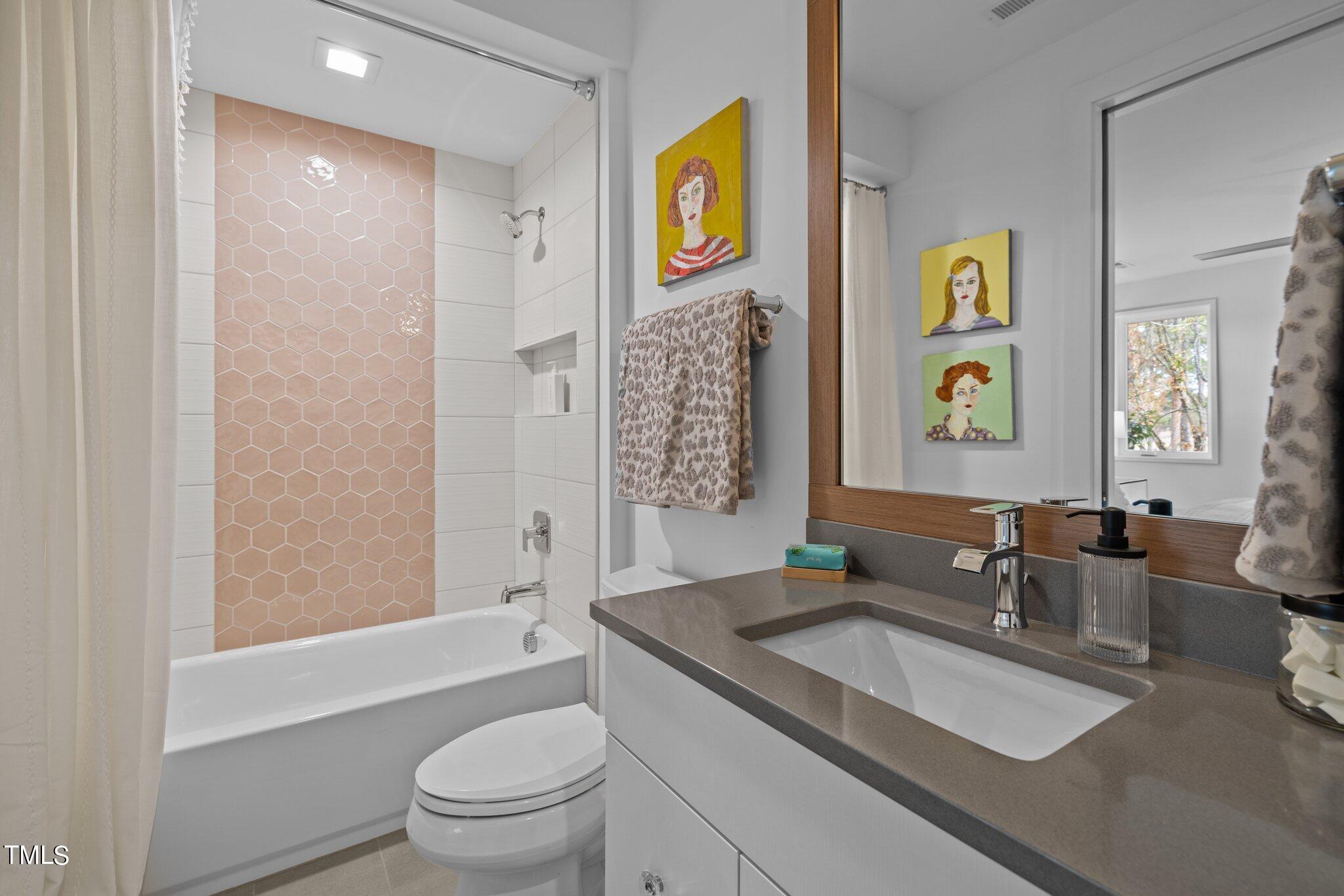 1711 Hunting Ridge Road Raleigh, NC 27615 - Photo 42 of 62 a bathroom with a granite countertop sink toilet and shower