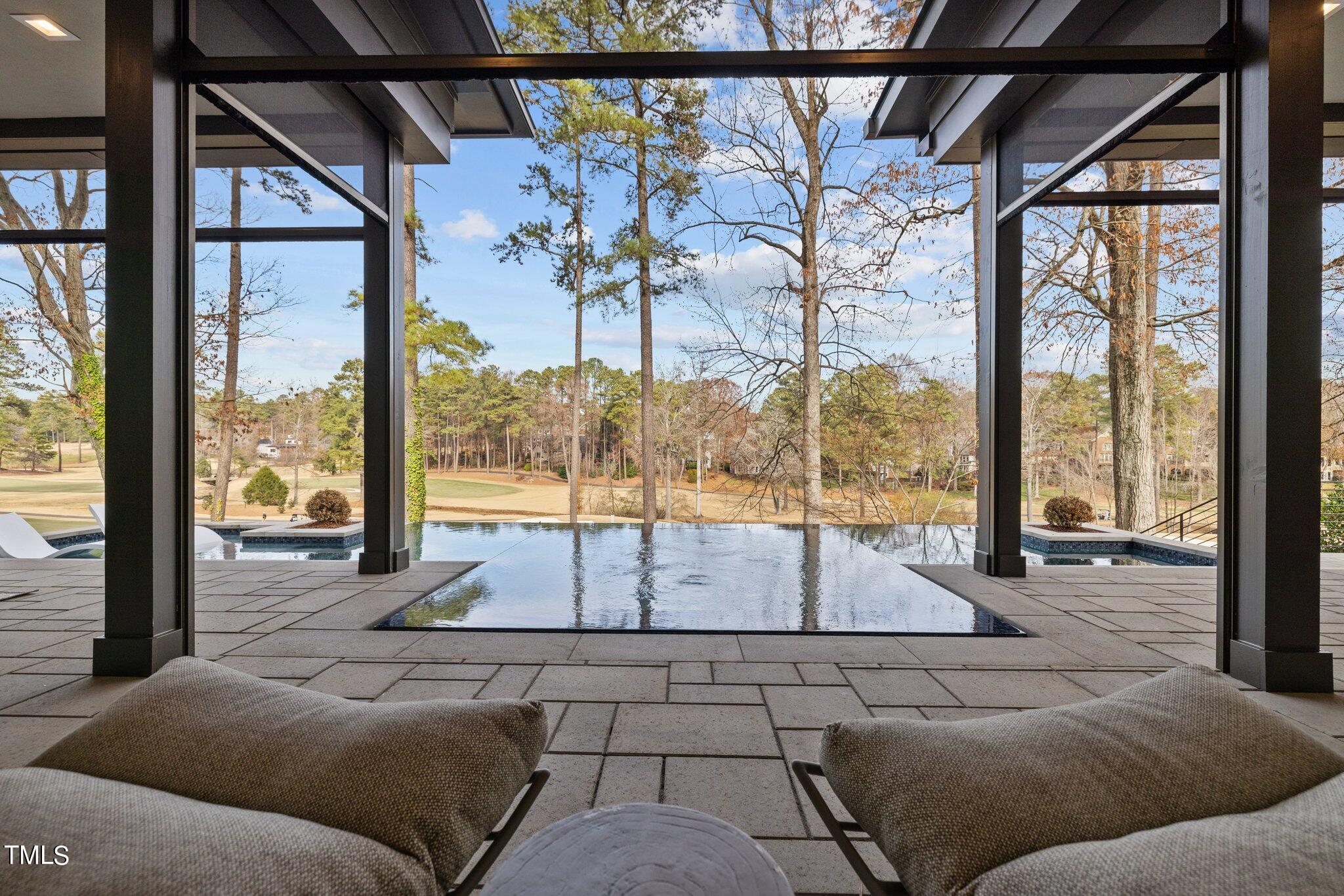1711 Hunting Ridge Road Raleigh, NC 27615 - Photo 46 of 62 a living room with a large window and couch