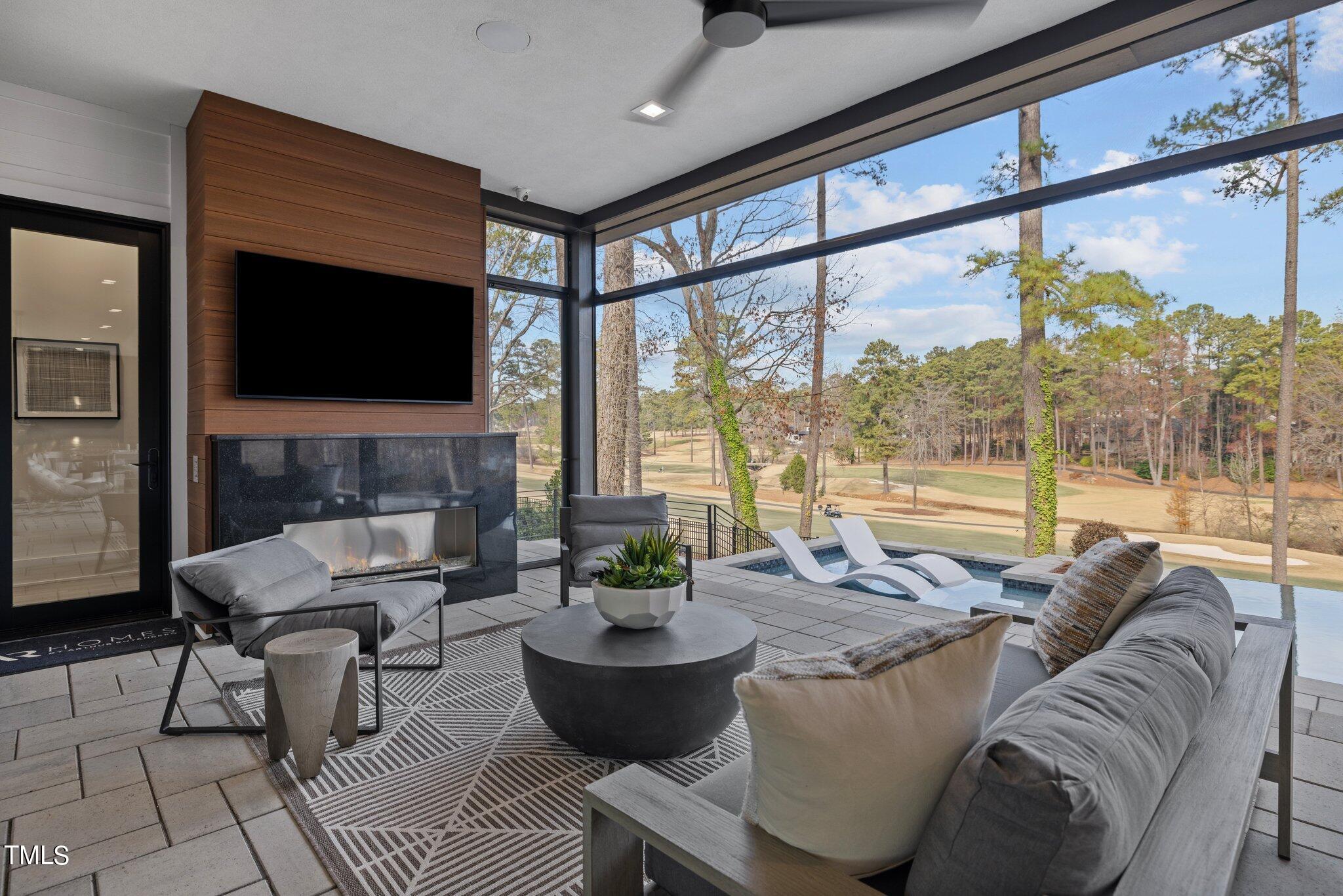 1711 Hunting Ridge Road Raleigh, NC 27615 - Photo 47 of 62 a living room with furniture and a flat screen tv