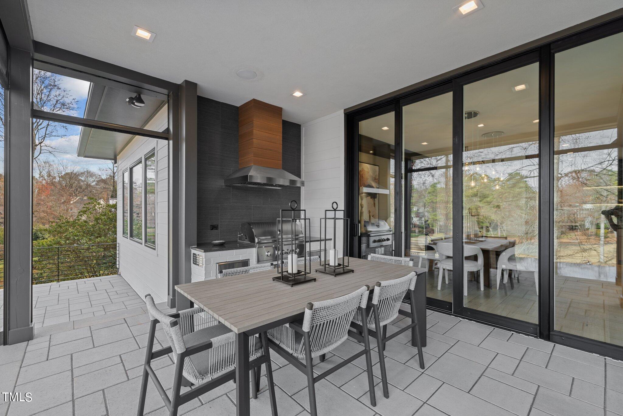 1711 Hunting Ridge Road Raleigh, NC 27615 - Photo 48 of 62 a view of a dining room with furniture window and outside view